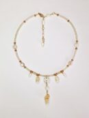 collier court coquillage